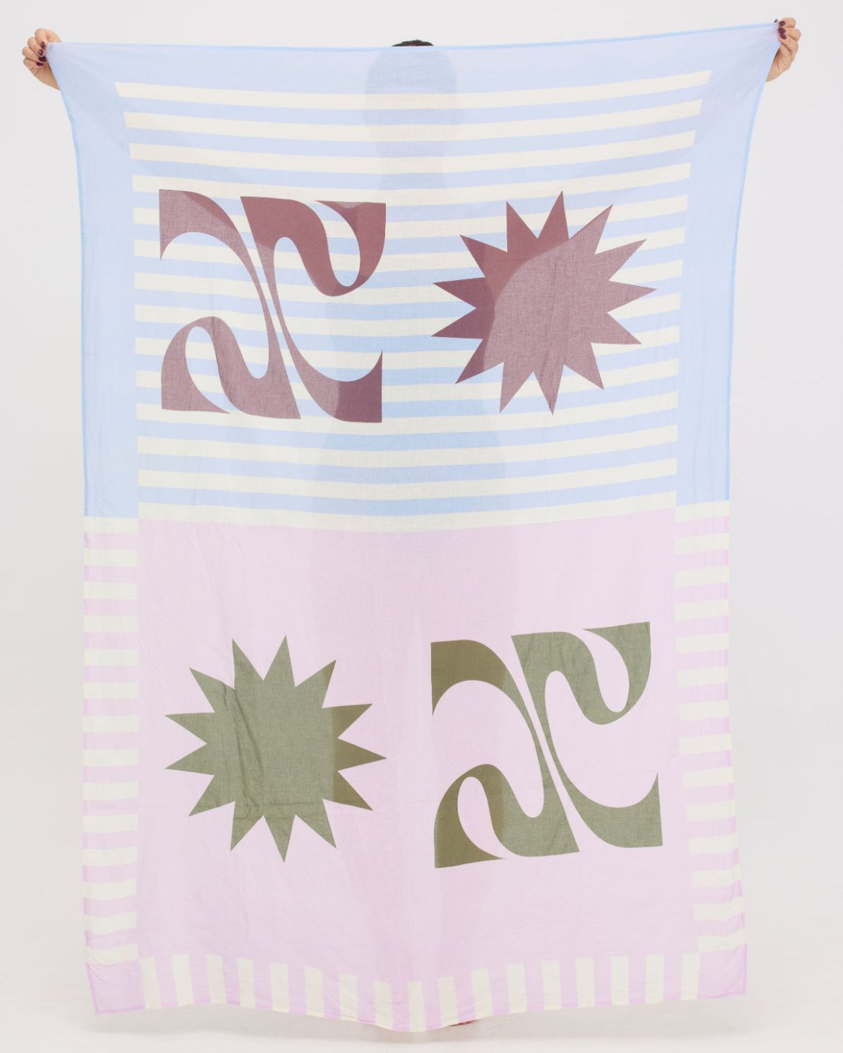 Colourful abstract lightweight HUZZAH Sarong held up by a woman